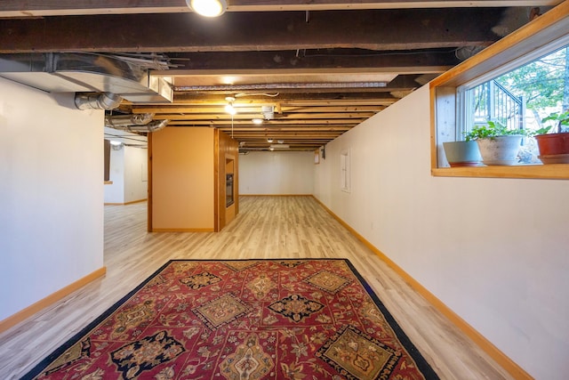 basement with light wood-type flooring