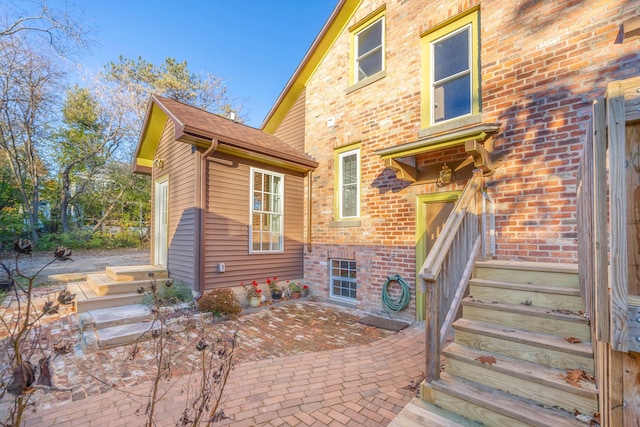 rear view of property featuring a patio