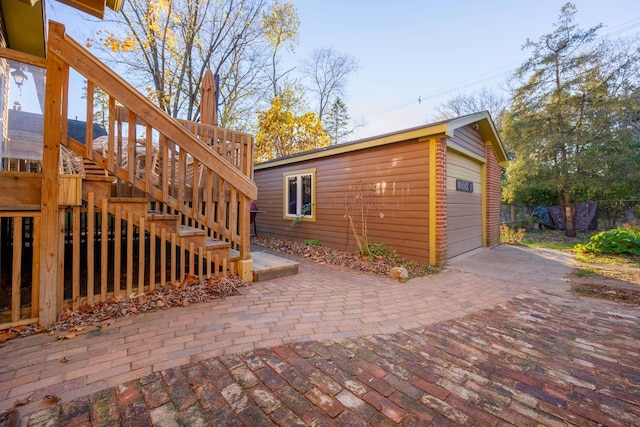 view of property exterior featuring a wooden deck