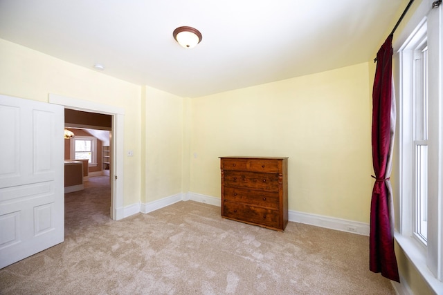 empty room featuring light carpet