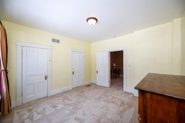 unfurnished bedroom with light carpet