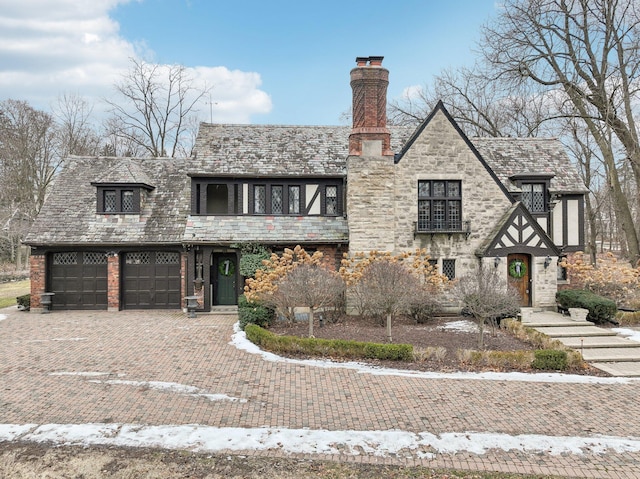 tudor-style house with a garage