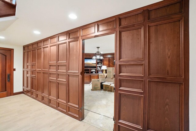 interior space featuring baseboards, recessed lighting, and wood finished floors