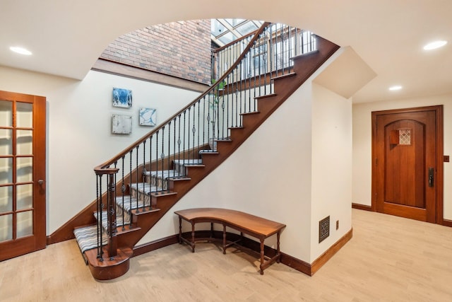 stairs featuring baseboards and wood finished floors