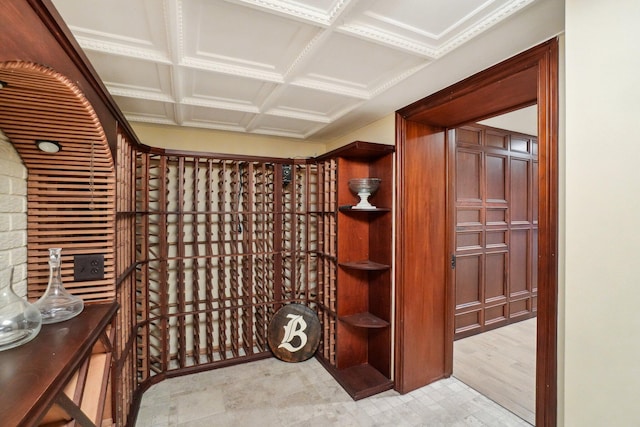wine room with coffered ceiling