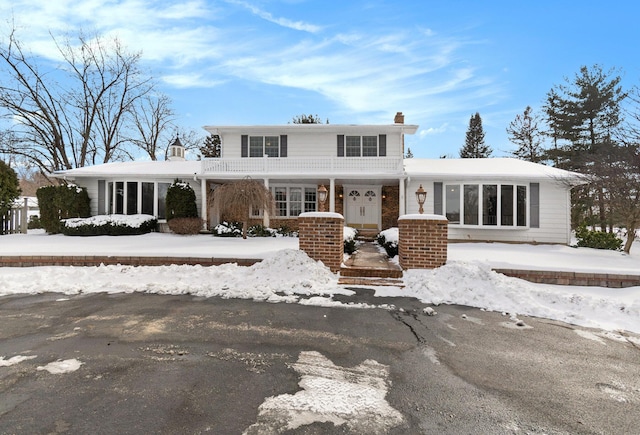 view of front of home with a chimney