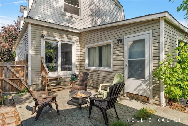 324 Gunnison Ave SW, Grand Rapids, MI 49504 - view of patio / terrace featuring an outdoor fire pit and entry steps