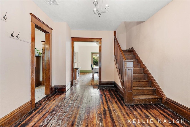 324 Gunnison Ave SW, Grand Rapids, MI 49504 - stairway featuring hardwood / wood-style flooring and baseboards