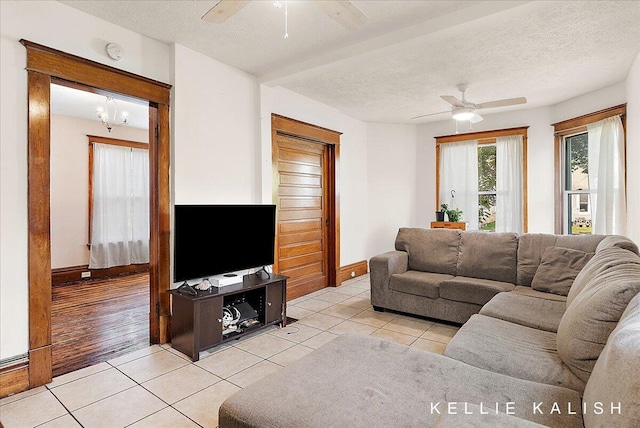324 Gunnison Ave SW, Grand Rapids, MI 49504 - living area with ceiling fan, light tile patterned floors, and a textured ceiling