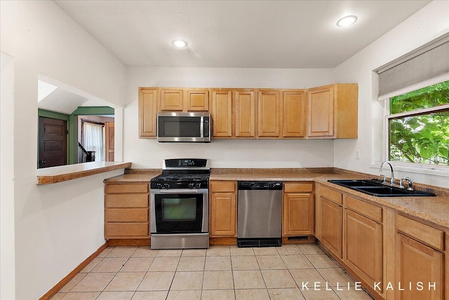324 Gunnison Ave SW, Grand Rapids, MI 49504 - kitchen with appliances with stainless steel finishes, light tile patterned floors, recessed lighting, and light countertops