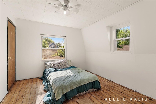 324 Gunnison Ave SW, Grand Rapids, MI 49504 - bedroom with multiple windows, wood-type flooring, and a ceiling fan
