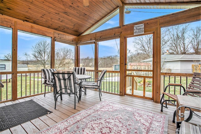 sunroom with wooden ceiling and vaulted ceiling