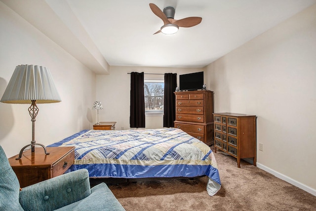 carpeted bedroom featuring a ceiling fan and baseboards