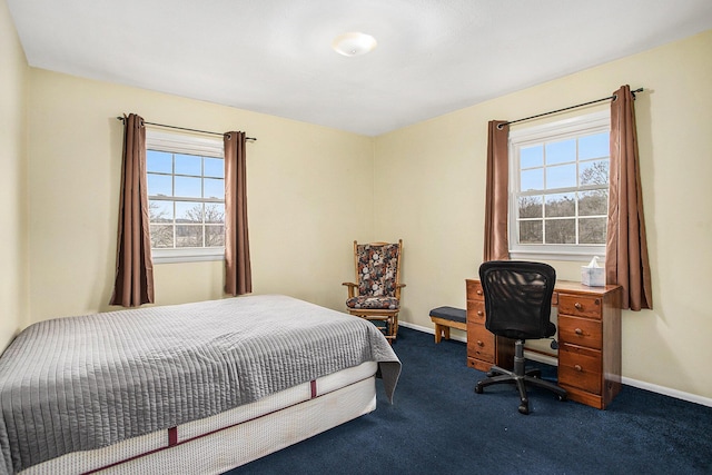 bedroom with carpet and baseboards