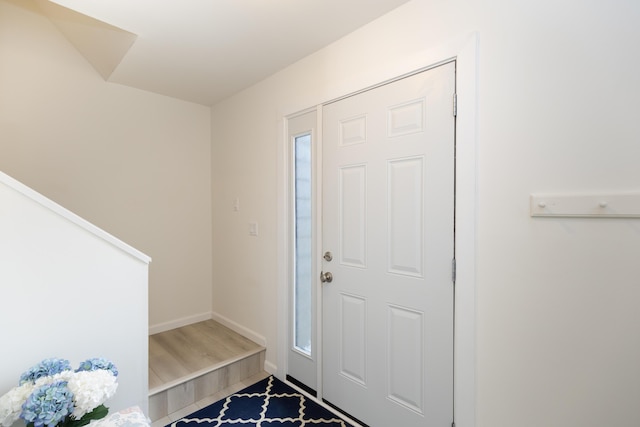 entryway with hardwood / wood-style floors