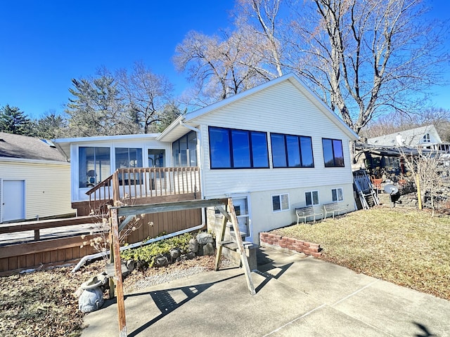 12118 N Sherman Lake Dr, Augusta, MI 49012 - view of front facade with a sunroom
