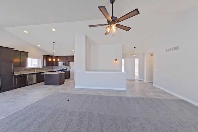 unfurnished living room with ceiling fan, high vaulted ceiling, recessed lighting, visible vents, and baseboards