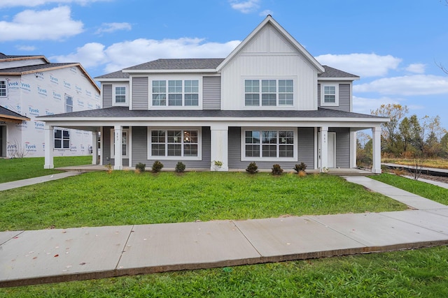 view of front of home with a front yard and a porch