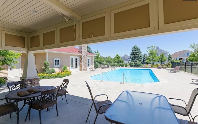 view of swimming pool featuring a patio area