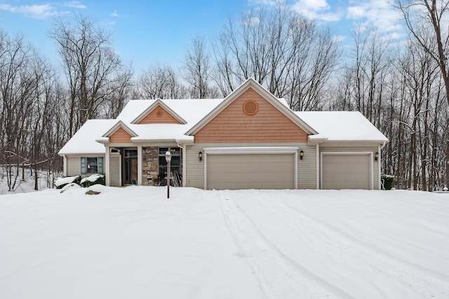 view of front facade featuring stone siding and an attached garage