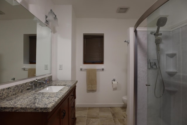 10773 Frankfort, Pinckney, MI 48169 - bathroom featuring vanity, toilet, and a shower with shower door