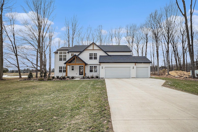 view of front of property featuring concrete driveway, a front lawn, and an attached garage