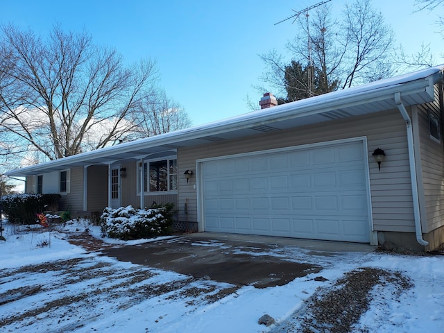 single story home featuring a garage