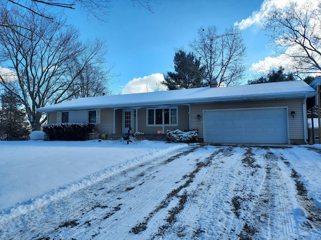 ranch-style house featuring a garage