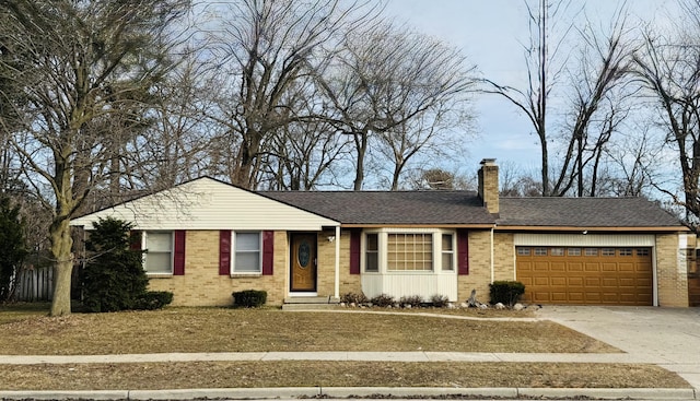 ranch-style house featuring a garage, brick siding, and a chimney