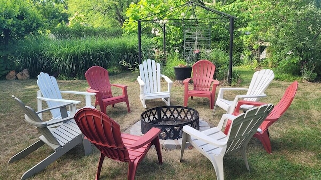 view of patio featuring a gazebo and an outdoor fire pit