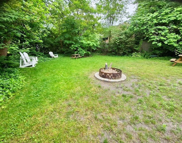 view of yard with an outdoor fire pit