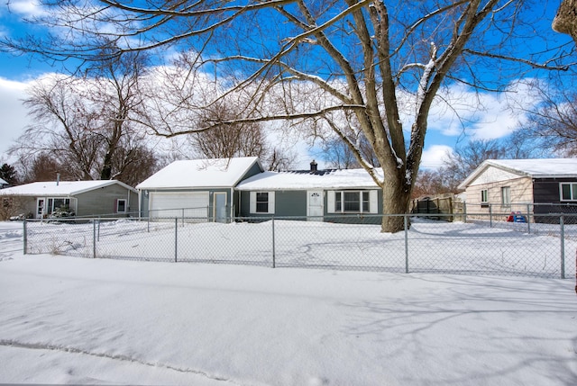 yard covered in snow featuring a garage