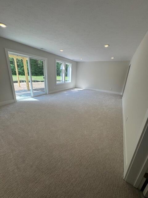 1967 Lowe Dr, Spring Lake, MI 49456 - carpeted empty room featuring baseboards and recessed lighting