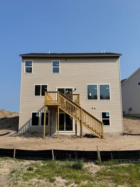 1967 Lowe Dr, Spring Lake, MI 49456 - rear view of property featuring stairs and a deck