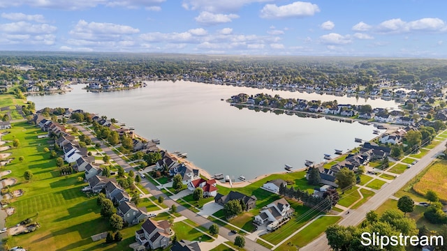 birds eye view of property with a water view and a residential view