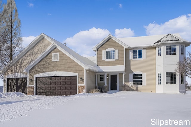 view of front of property with a garage