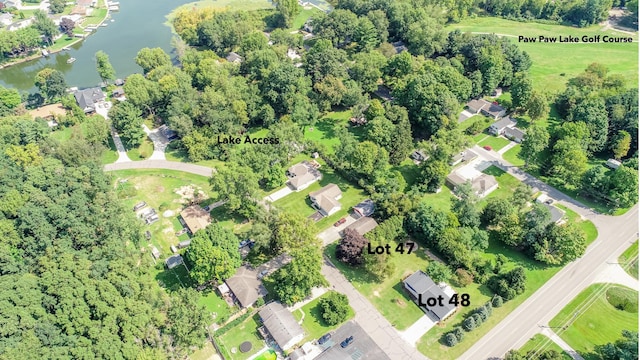 bird's eye view featuring a residential view and a water view