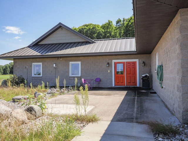 entrance to property with a standing seam roof and metal roof