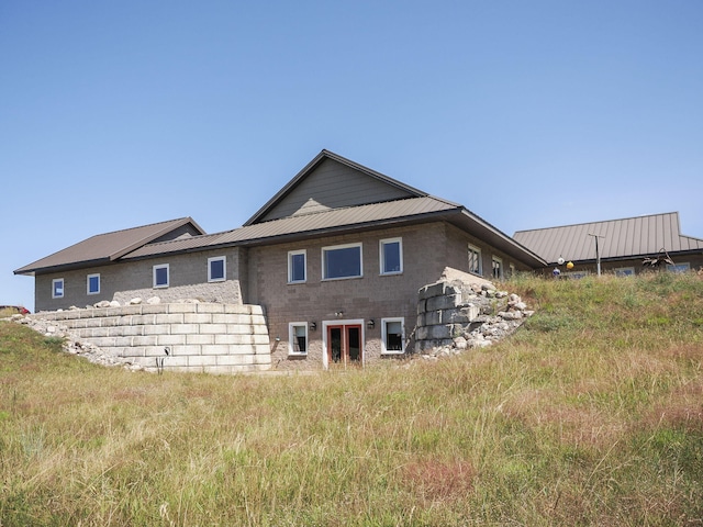 rear view of house with metal roof