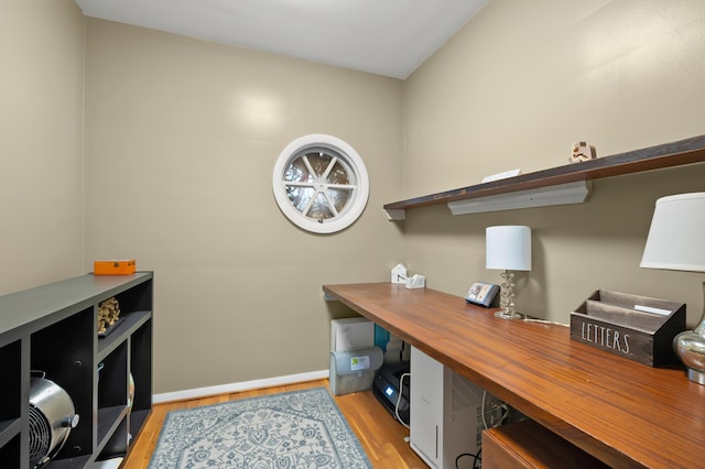 home office featuring light wood finished floors and baseboards