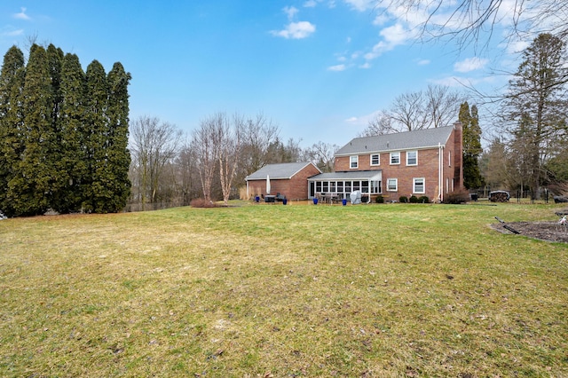 view of yard with a sunroom