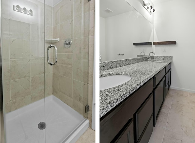 bathroom with vanity and a shower with door