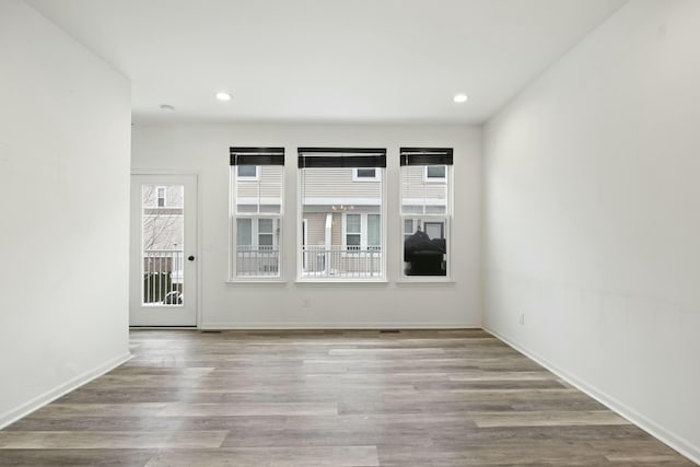 unfurnished room featuring light hardwood / wood-style flooring