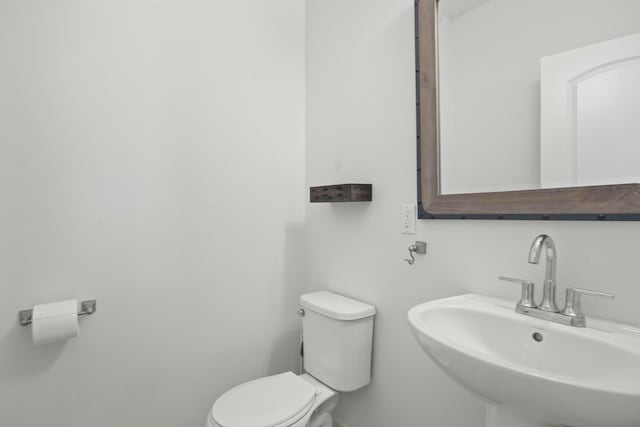 bathroom with sink and toilet