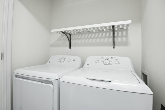 laundry area with independent washer and dryer