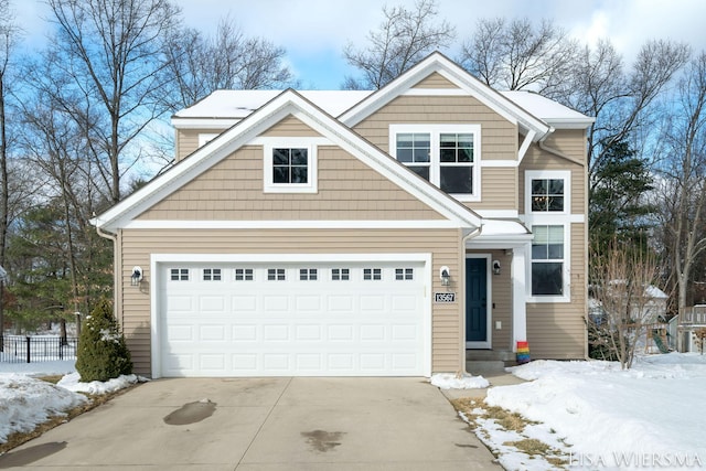 view of front of house featuring driveway, a garage, and entry steps