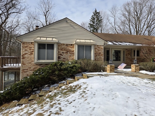 view of front of house featuring brick siding