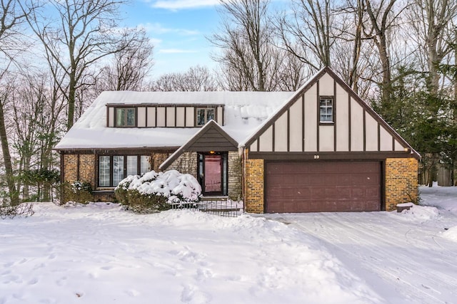 tudor house featuring a garage