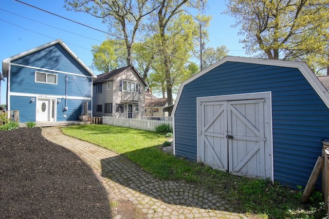 view of shed with fence