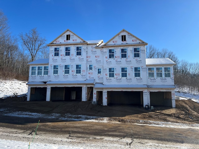 property in mid-construction with a garage